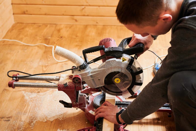 Carpentry work — cutting timber with a circular saw